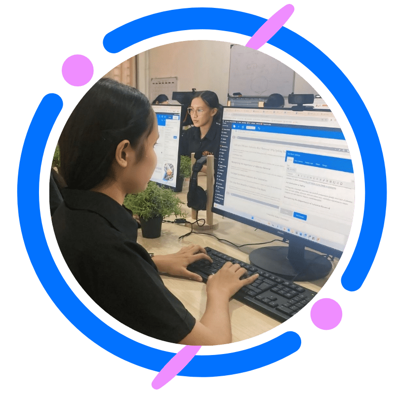 Professional focusing on website design, typing at her workstation.