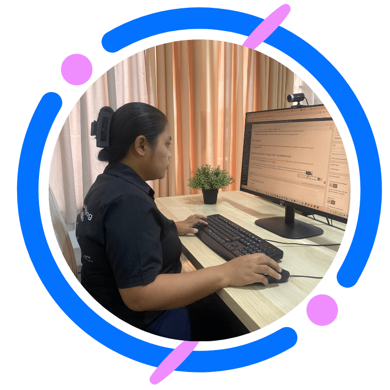 Professional woman working on SEO Services at a computer desk with monitor, keyboard, and in Professional woman working on SEO Services at a computer desk with monitor, keyboard, and indoor plant in office setting.door plant in office setting.