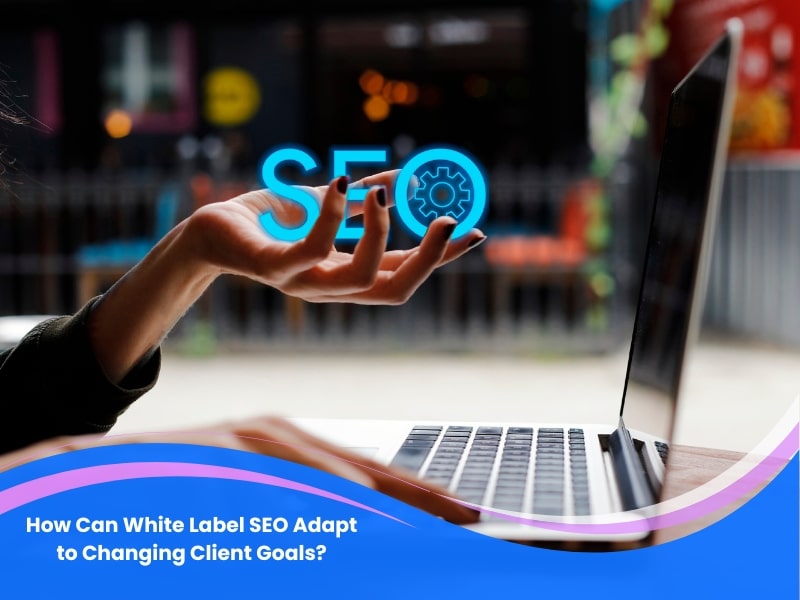 A person's hand holding a glowing "SEO" symbol above a laptop, illustrating how white label SEO adaptability can address changing client goals. Sources and related content