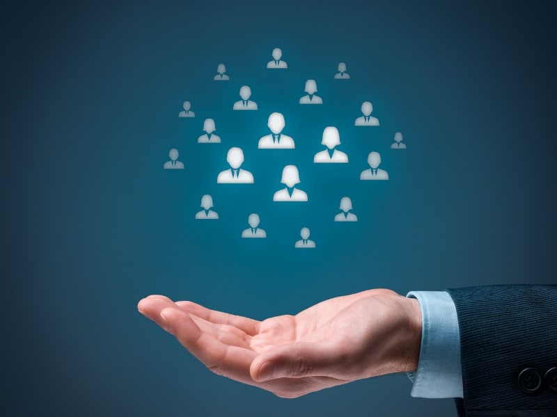 Icons representing clients above a hand, symbolising white label Google Ads management support and scalability.