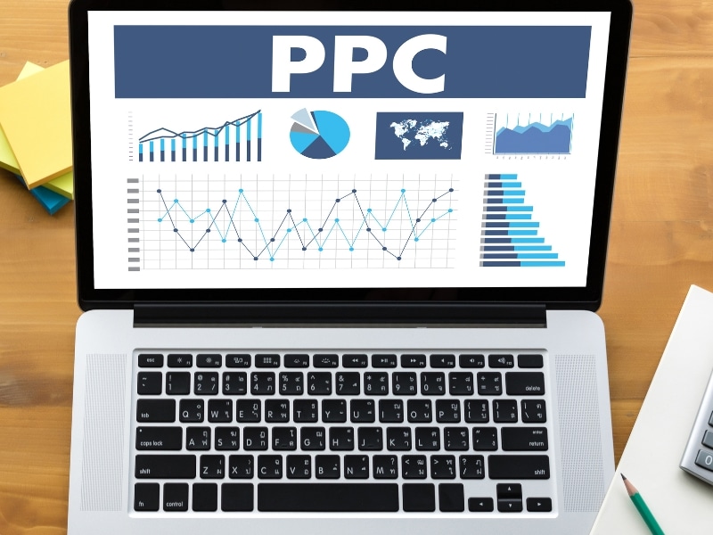 Laptop displaying PPC analytics charts and graphs illustrating effective PPC management for small business campaigns