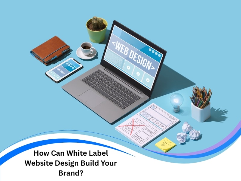 website design white label setup with laptop, wireframes, and mobile device on a creative desk